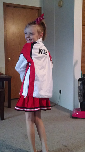 Obie in cheerleader jacket